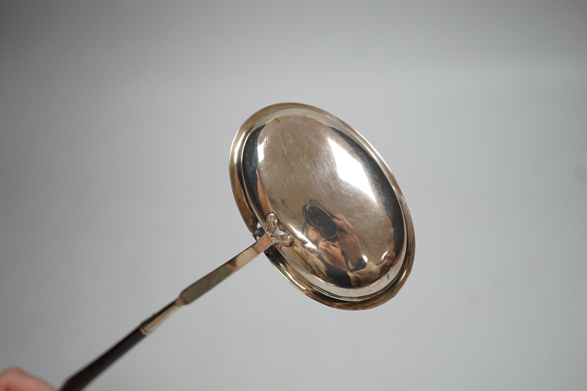An early 19th century silver toddy ladle with demi barley twist baleen handle, maker IS?, maker's mark and duty mark only, 36.5cm.